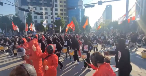 Protesters in 'Squid Game' costumes