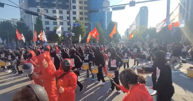 Protesters in 'Squid Game' costumes