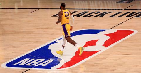 Lebron James running on a court with the NBA logo on it on July 30, 2020