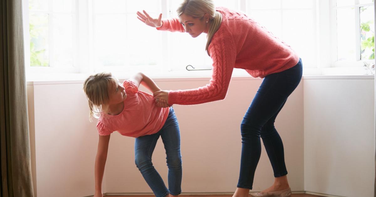 mother hitting young daughter picture id