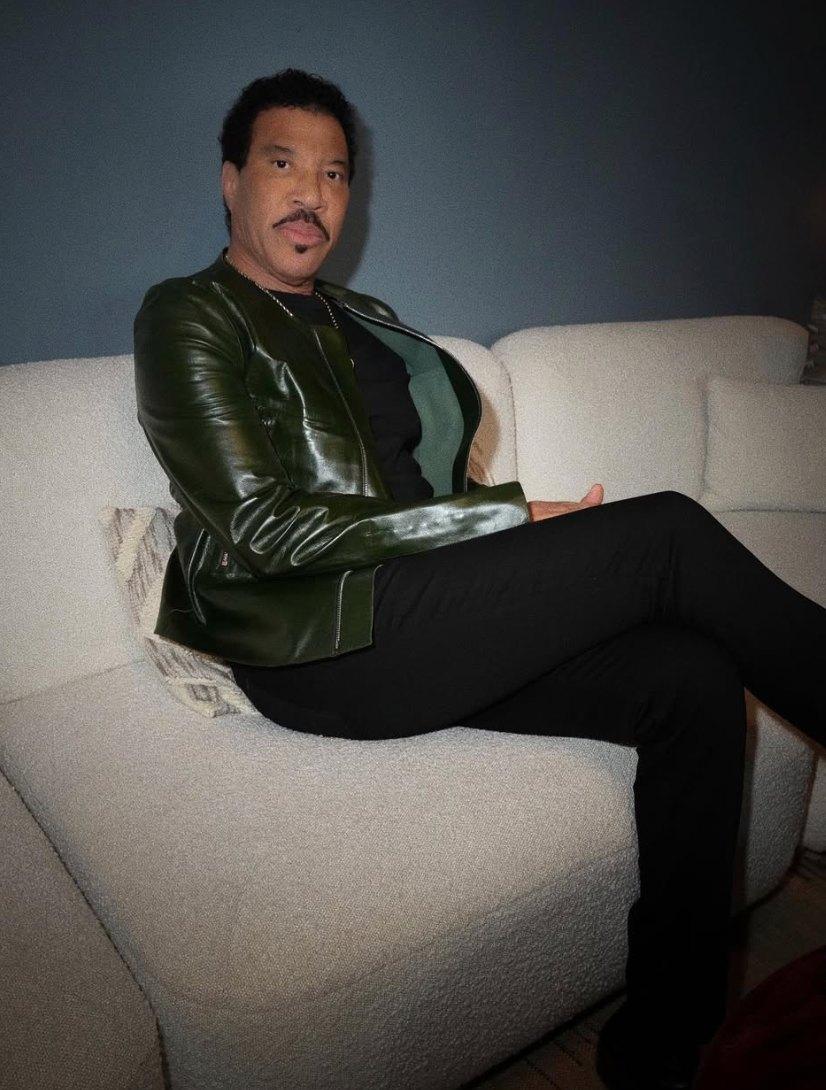 Lionel Richie sitting on a pillow.