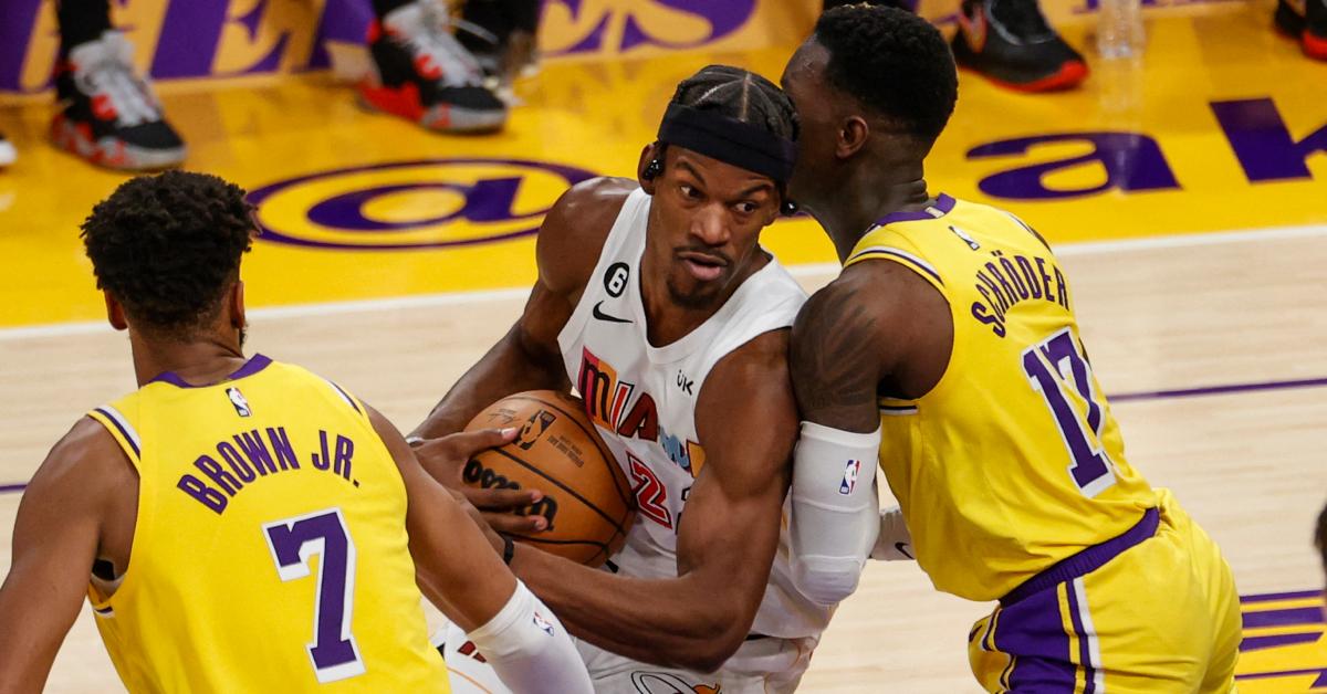 Jimmy Butler fights of the ball against Troy Brown Jr. and Dennis Schroder during the Heat-Lakers game on Jan. 4, 2023.