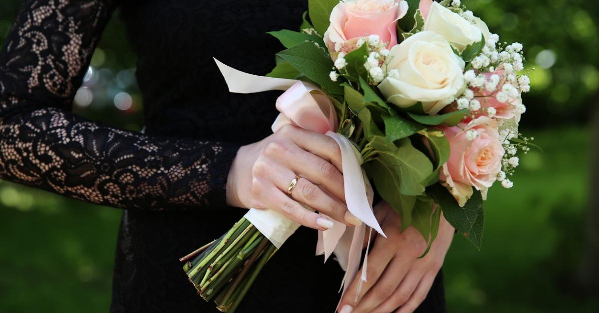 bride in black wedding dress with wedding bouquet picture id