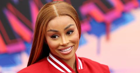 Blac Chyna wears a red letterman jacket at Spiderman premiere red carpet.