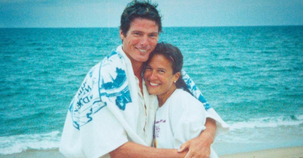 Christopher Reeve and Dana Reeve hugging on the beach