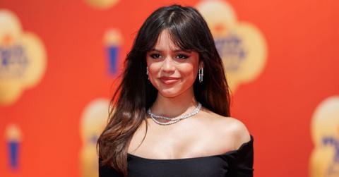 Jenna Ortega wearing a black dress to an event.