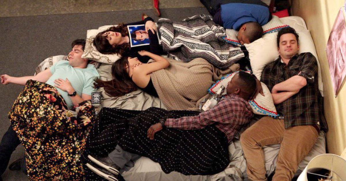 The cast of 'New Girl' cuddles on set.