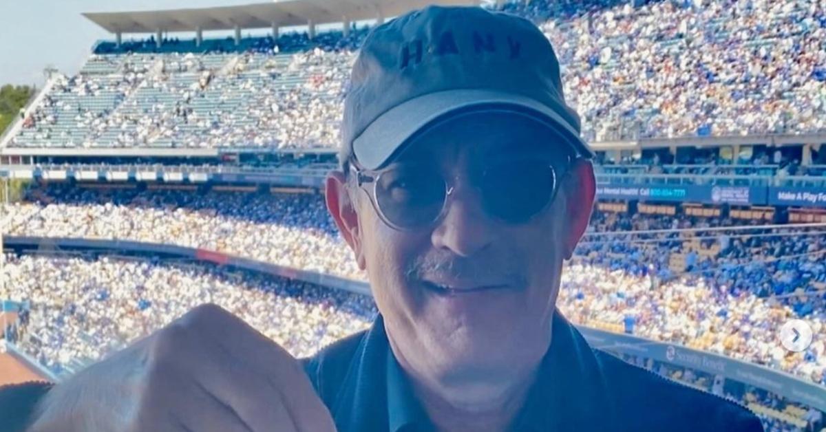 Tom Hanks wears Hanx baseball cap at a game