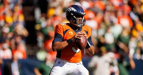 Russell Wilson preparing to throw during a game against the Green Bay Packers.
