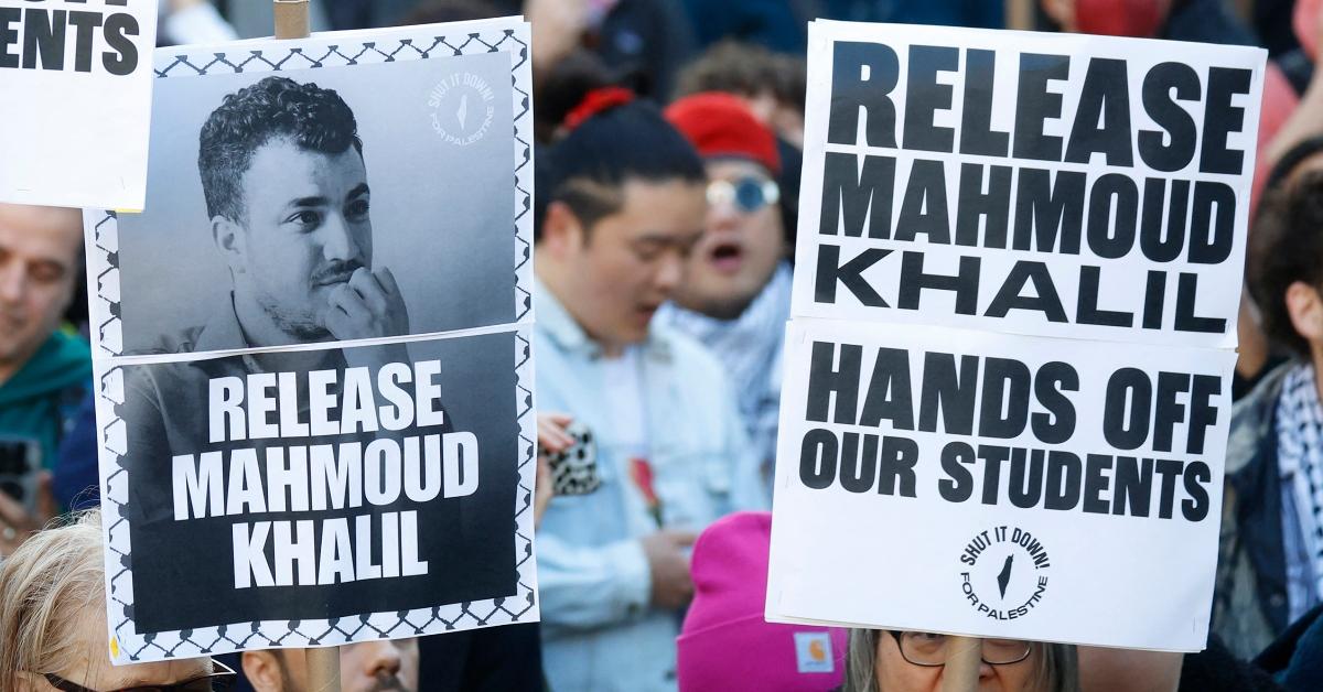 Protestors hold up signs demanding the release of Mahmoud Khalil