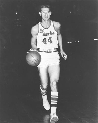 Jerry West playing basketball