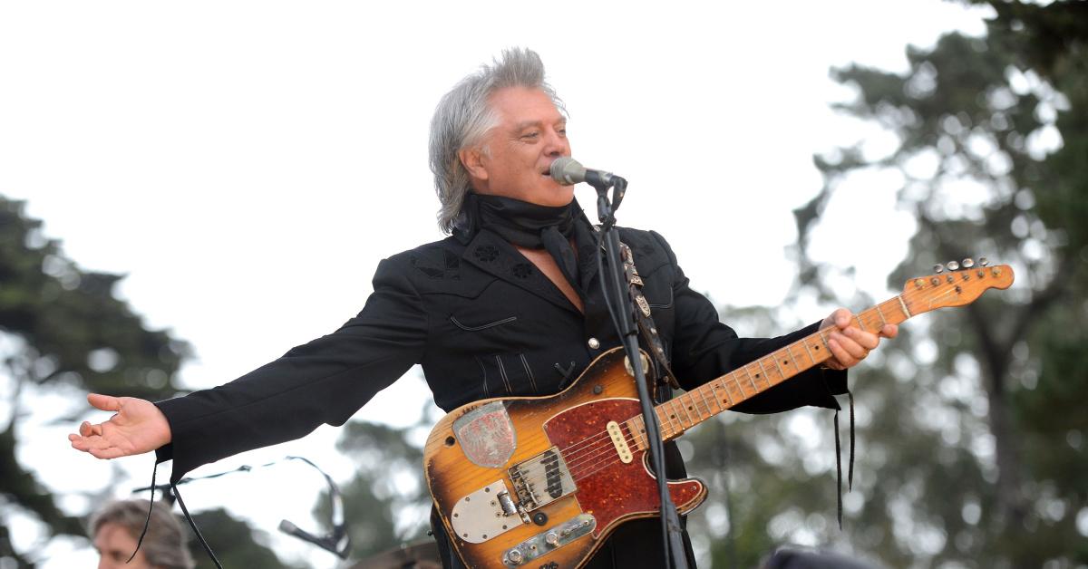 why does marty stuart always wear a scarf