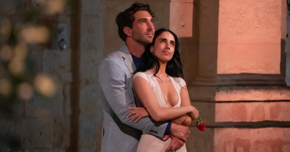 Joey Graziadei stands behind Maria Georgas with his arms around her waist in Season 28 of 'The Bachelor.'