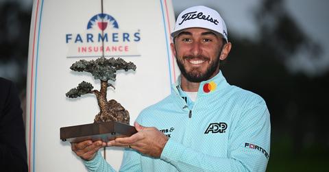 Max Homa holding a trophy at the Farmers Insurance Open
