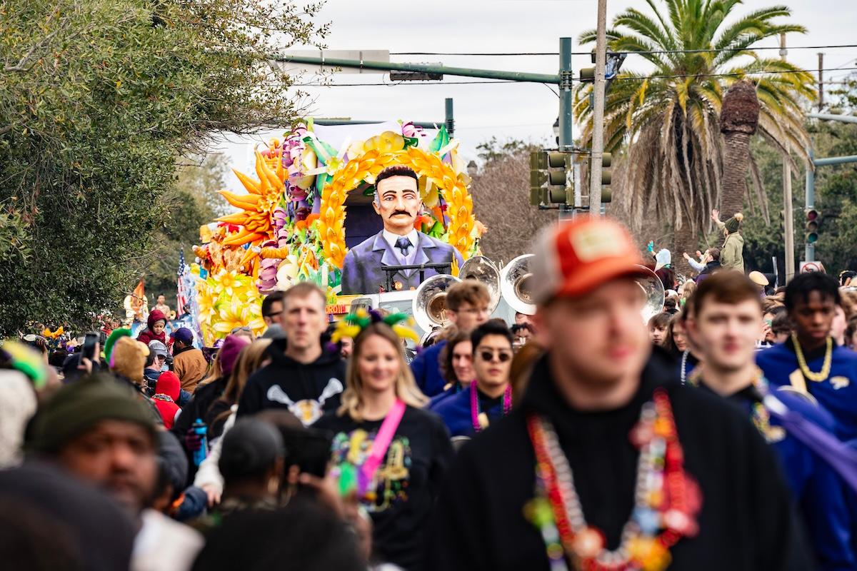 A float among a crowd in a 2024 Mardi Gras parade
