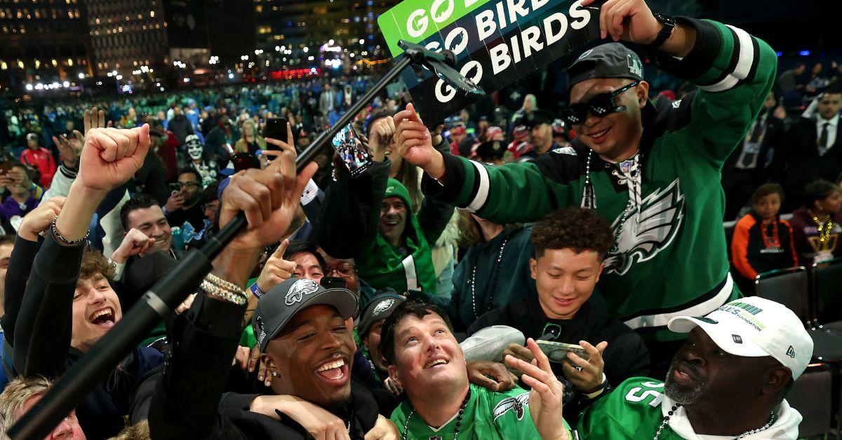 Quinyon Mitchell celebrates with fans after being selected 22nd overall by the Philadelphia Eagles