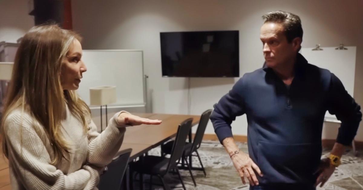 Karen Read (L) speaks with her attorney, Alan Jackson (R)