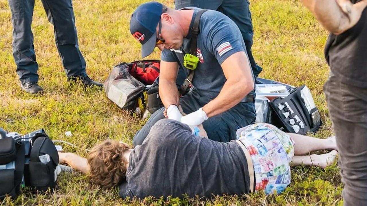 Danny Duncan being worked on by paramedics after an accident