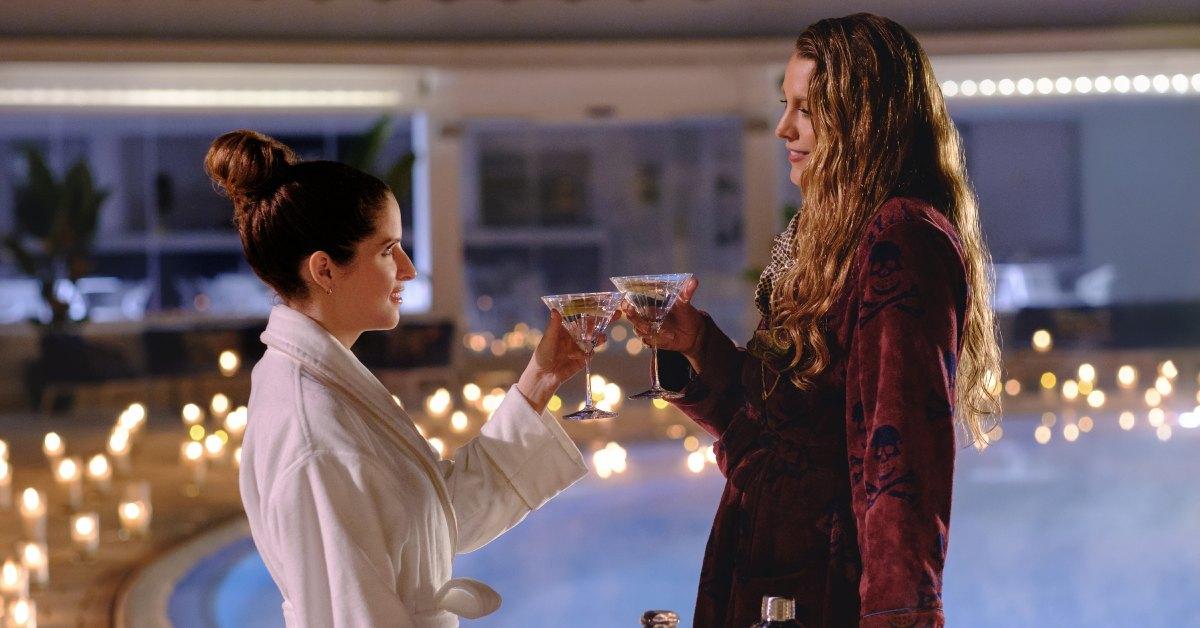 Emily and Stephanie in 'Another Simple Favor' toasting.