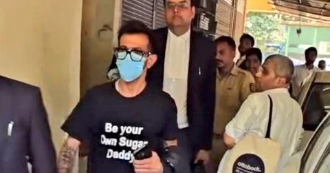 Yuzi Chahal wearing a "be your own sugar daddy" shirt.