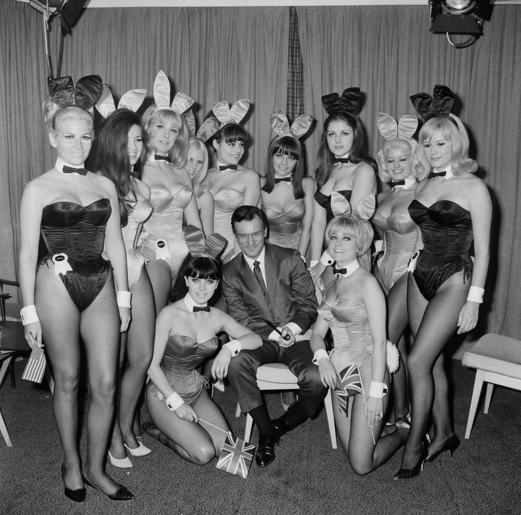 Hugh Hefner and Playmates. SOURCE: GETTY IMAGES
