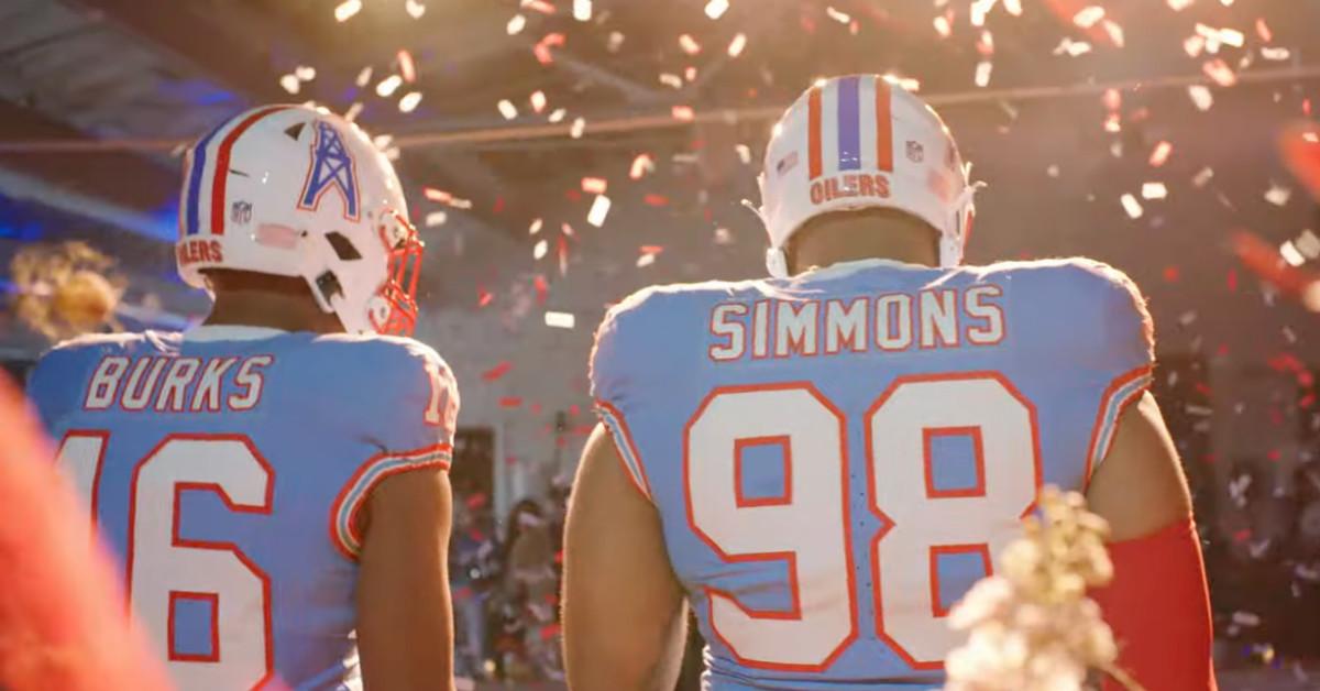 Tennessee Titans' Treylon Burks and Jeffery Simmons modeling the team's Houston Oilers throwback uniforms