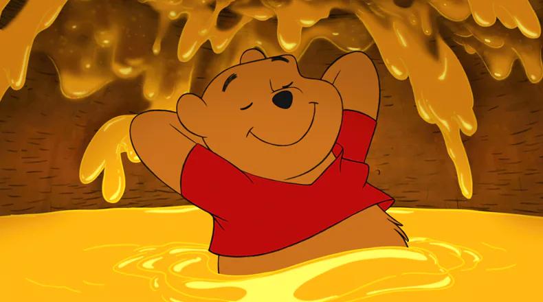 https://media.distractify.com/brand-img/wPmE59t4g/0x0/winnie-the-pooh-bathing-in-honey-1642517922605.jpg