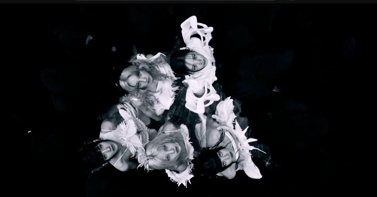 I-DLE in a video in black and white. 