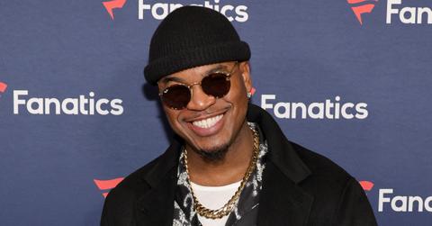 Ne-Yo wearing chain, sunglasses, hat, black jacket at 2024 Super Bowl party