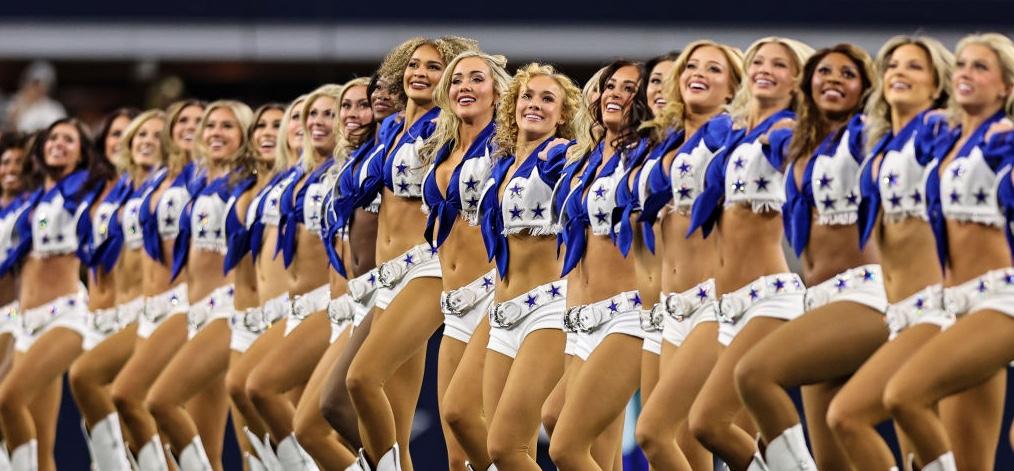 A group of Dallas Cowboys cheerleaders in a line