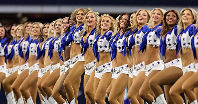A group of Dallas Cowboys cheerleaders in a line