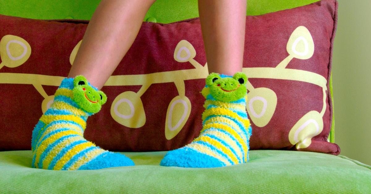 child wears frog socks