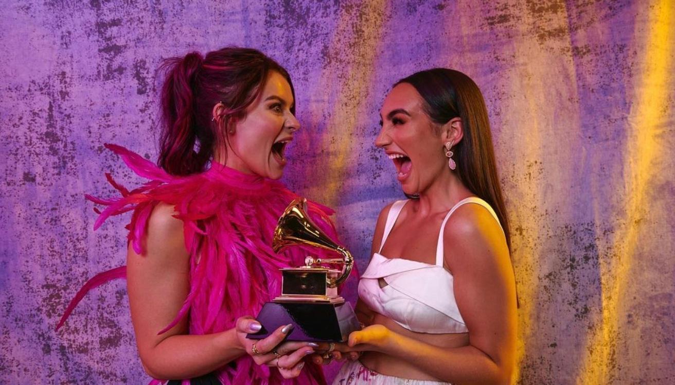 Abigail Barlow and Emily Bear holding their Grammy