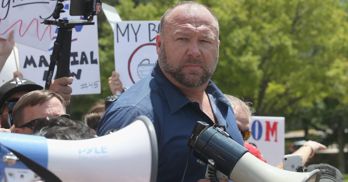 Alex Jones speaks to protestors gathered outside the Texas State Capitol during a rally calling for the reopening of Austin and Texas on April 25, 2020