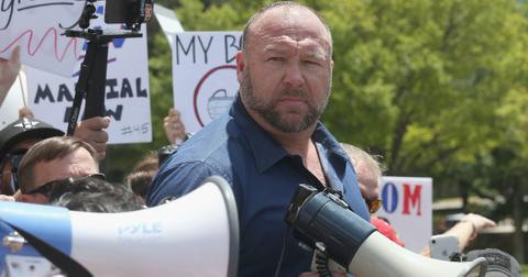 Alex Jones speaks to protestors gathered outside the Texas State Capitol during a rally calling for the reopening of Austin and Texas on April 25, 2020