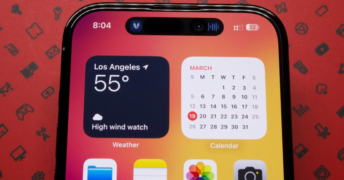 An iPhone with a calendar on the home screen.