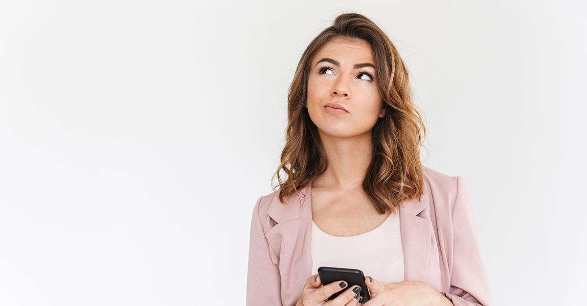 Woman thinking on her phone