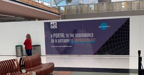 An advertisement for DEN at the Denver International Airport