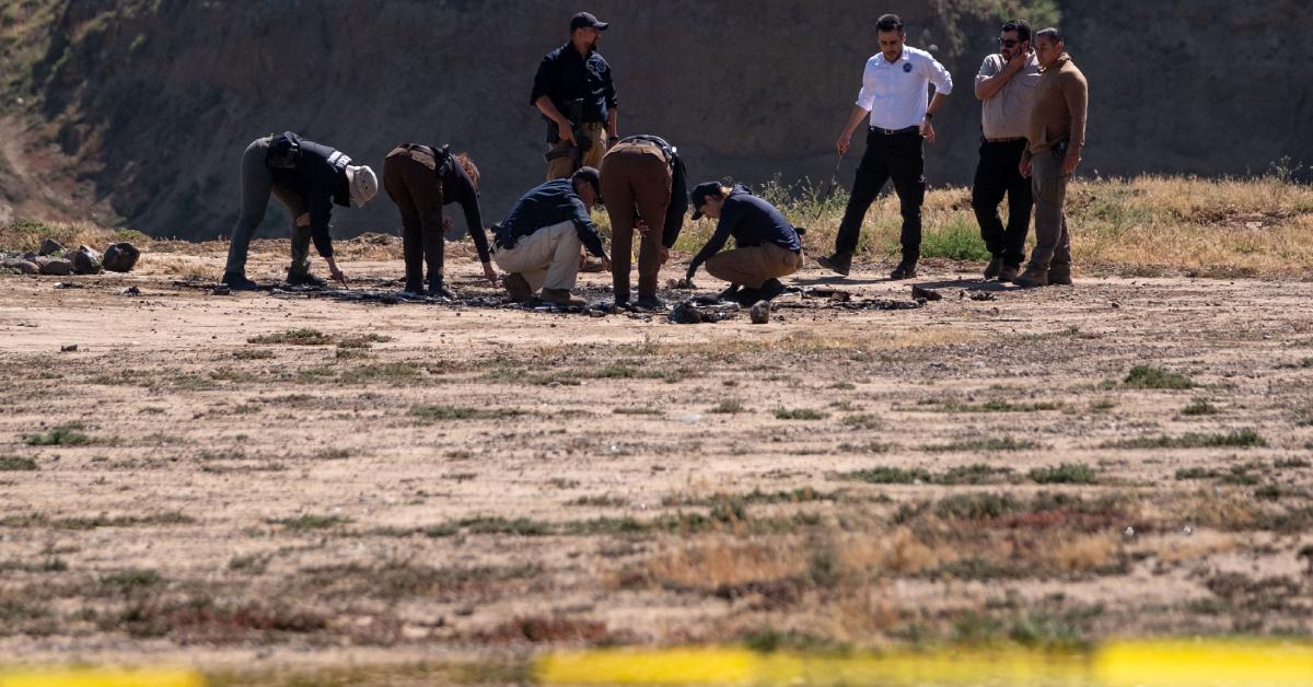 State prosecutors searching the camp site in Ensenada, Baja California state, Mexico