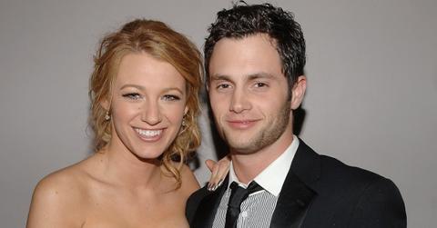 Blake Lively and Penn Badgley smiling for the camera at a Met Gala afterparty in 2008