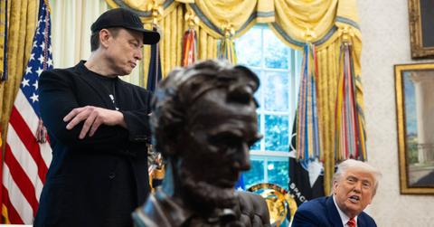 Elon Musk and President Donald Trump, with a bust of Abraham Lincoln in the foreground