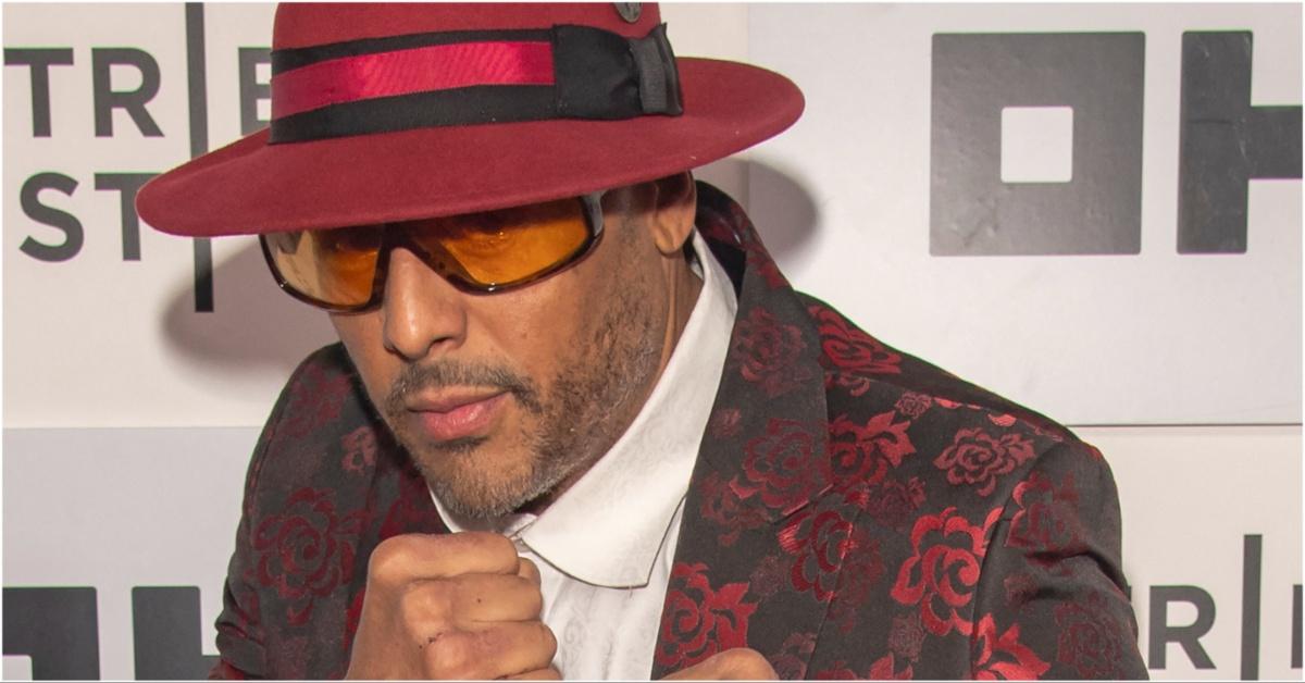 Al B. Sure!’s posing in colored shades