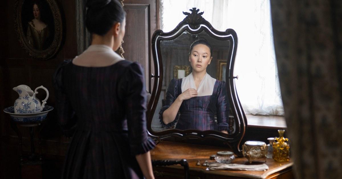 Sophie looking at her necklace in Season 4 of 'Bridgerton'.