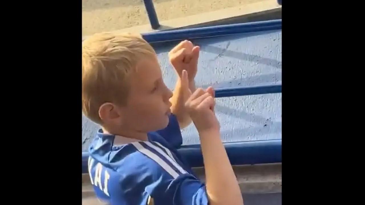 The young Leicester City fan taunts two adults