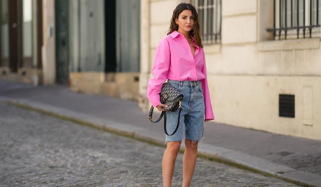 Alexandra Pereira wearing styling jorts with bright pink button up.