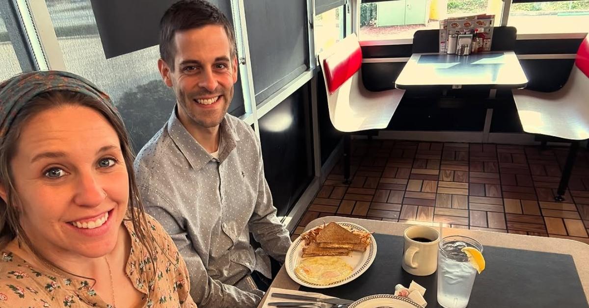 Jilll and Derick Dillard sit at a table in a restaurant