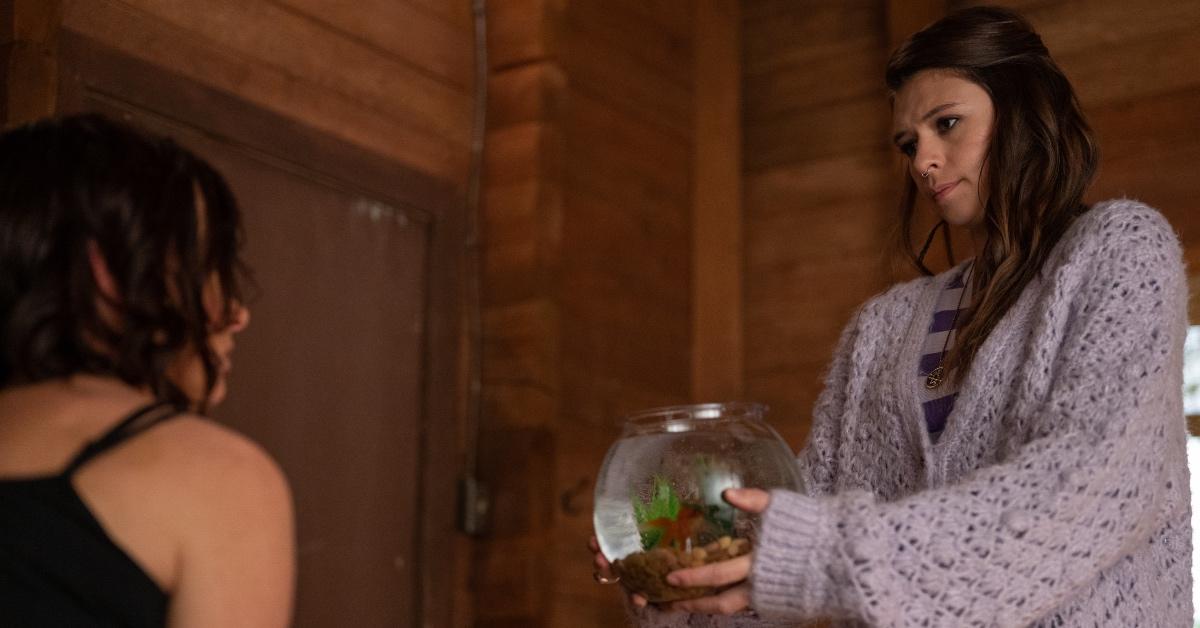 Lisa (Nicole Maines) gives Natalie (Juliette Lewis) her fish in a gesture of goodwill as Natalie mourns Travis.