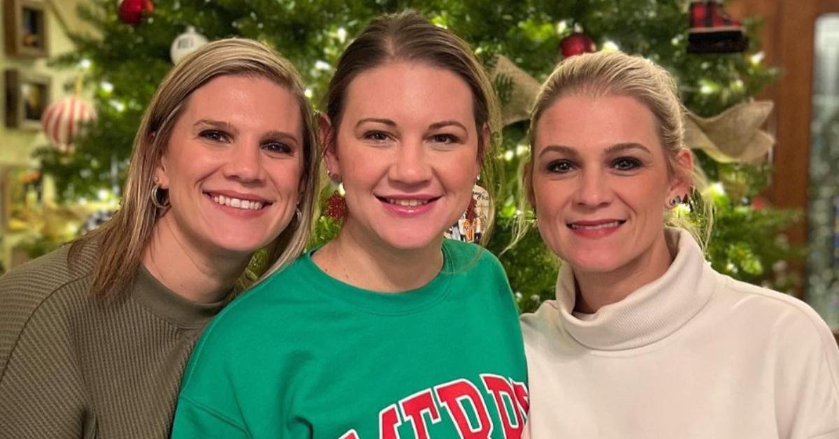 Crystal, Danielle, and Ashley pose in front of Christmas tree.