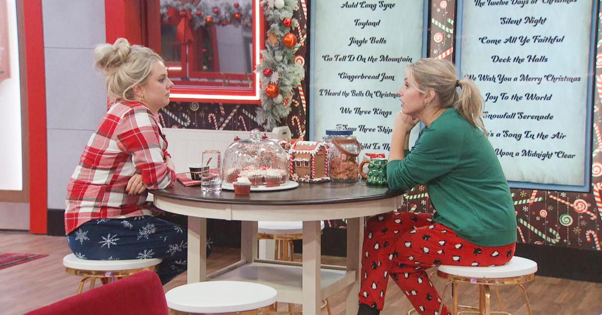 Nicole Franzel and Britney Haynes sit and talk in the 'Big Brother Reindeer Games' kitchen.