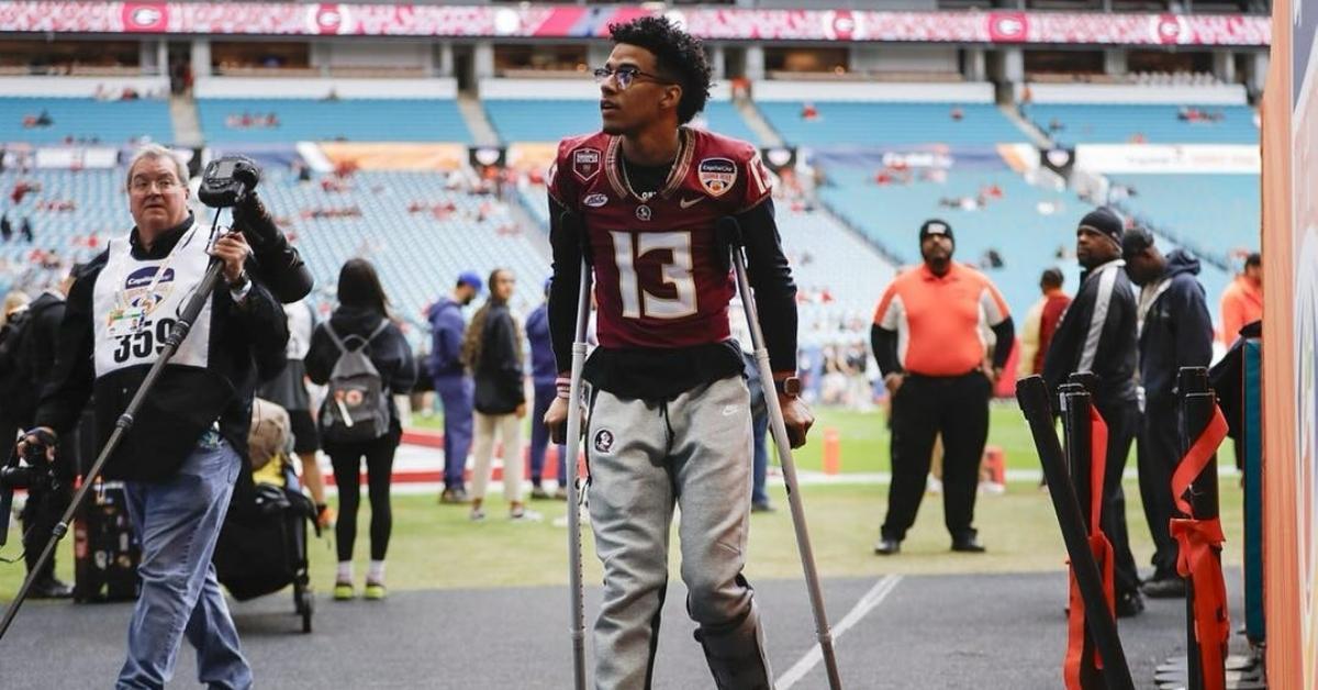 Jordan Travis walking off the field